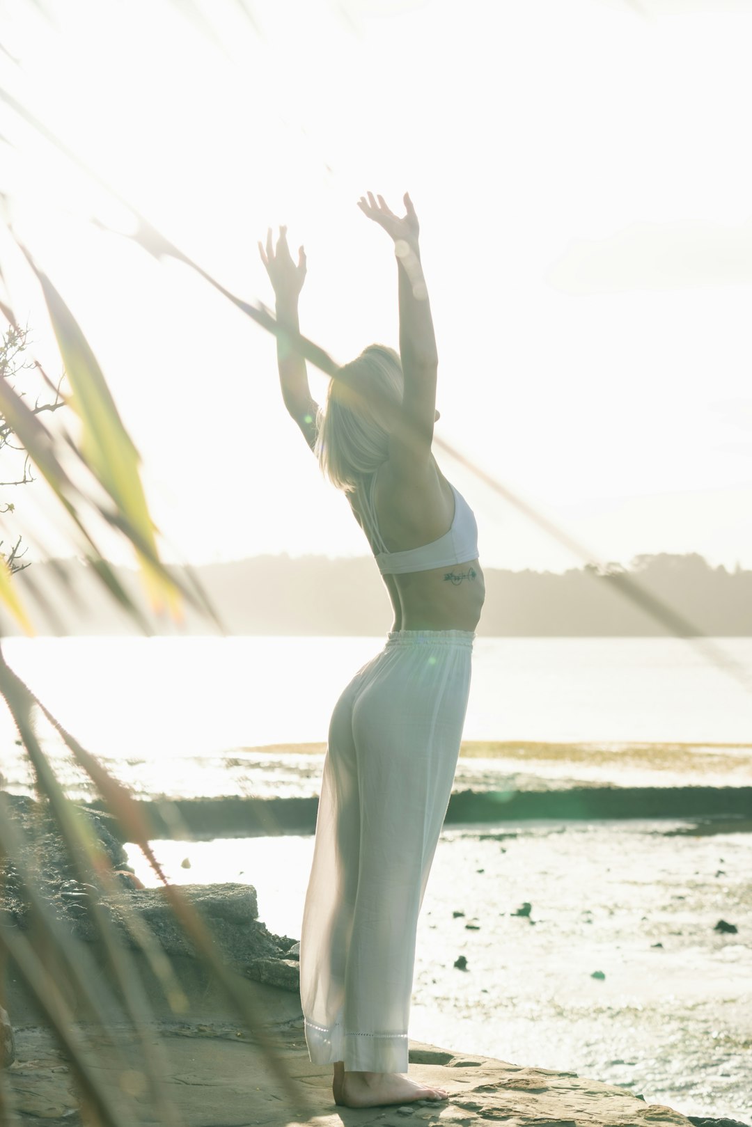 our-mission woman-standing-near-body-of-water-zdldggbi9ow